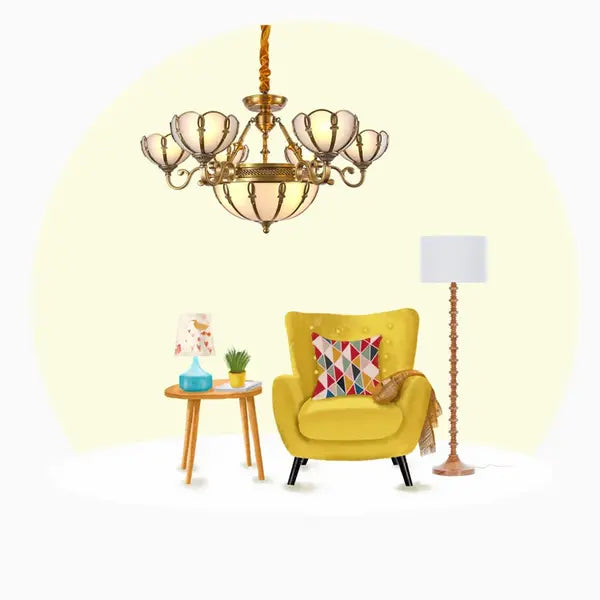 a decorative traditional chandelier is hanged above a yellow sofa, one floor lamp and a blue table lamp is also there