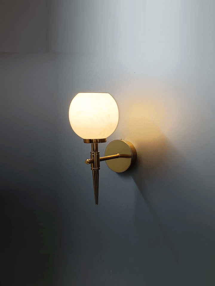 Modern wall light featuring PVD gold and genuine marble