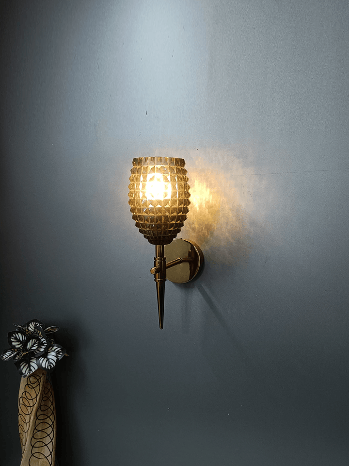 Luxurious wall lamp: gold PVD finish & smoky lead glass