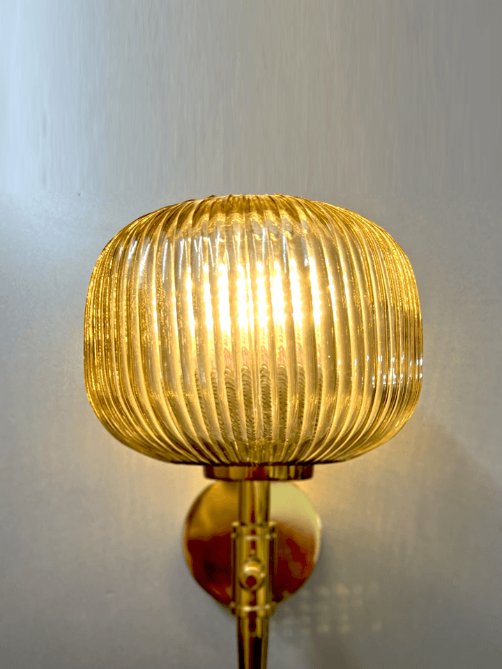 Close-up of gold PVD finish on the wall light fixture.