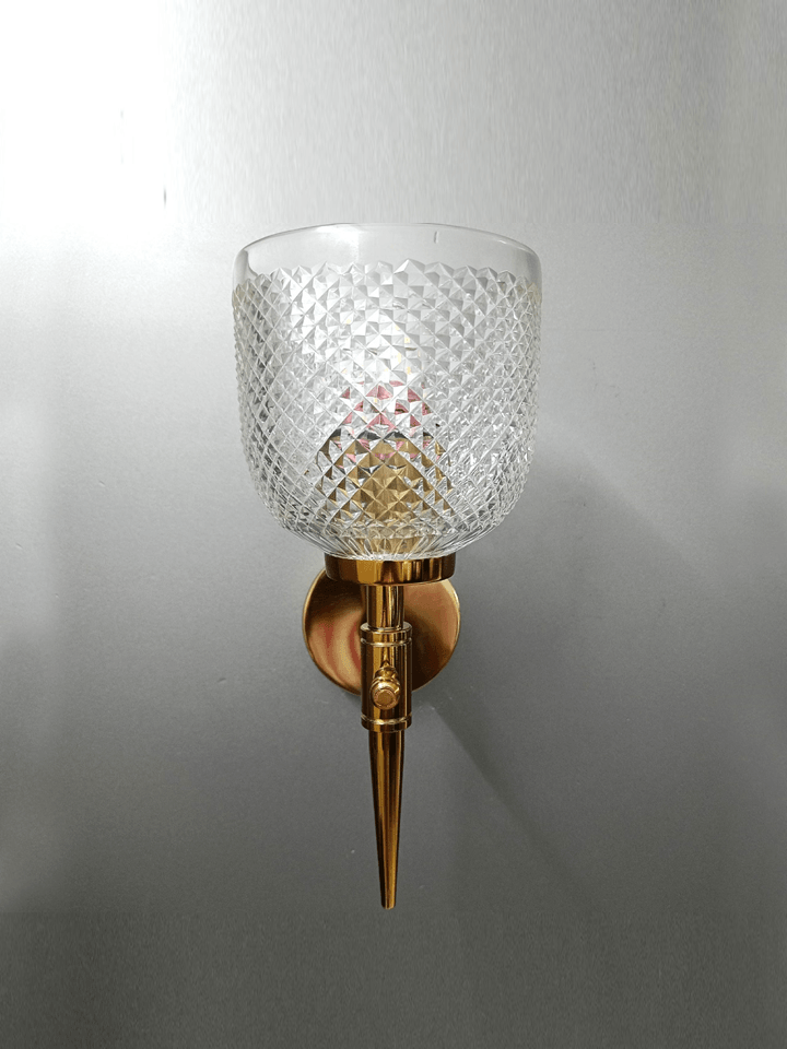 Luxuriate in the beauty of crystal with this gold PVD wall lamp, perfect for bedroom lighting.