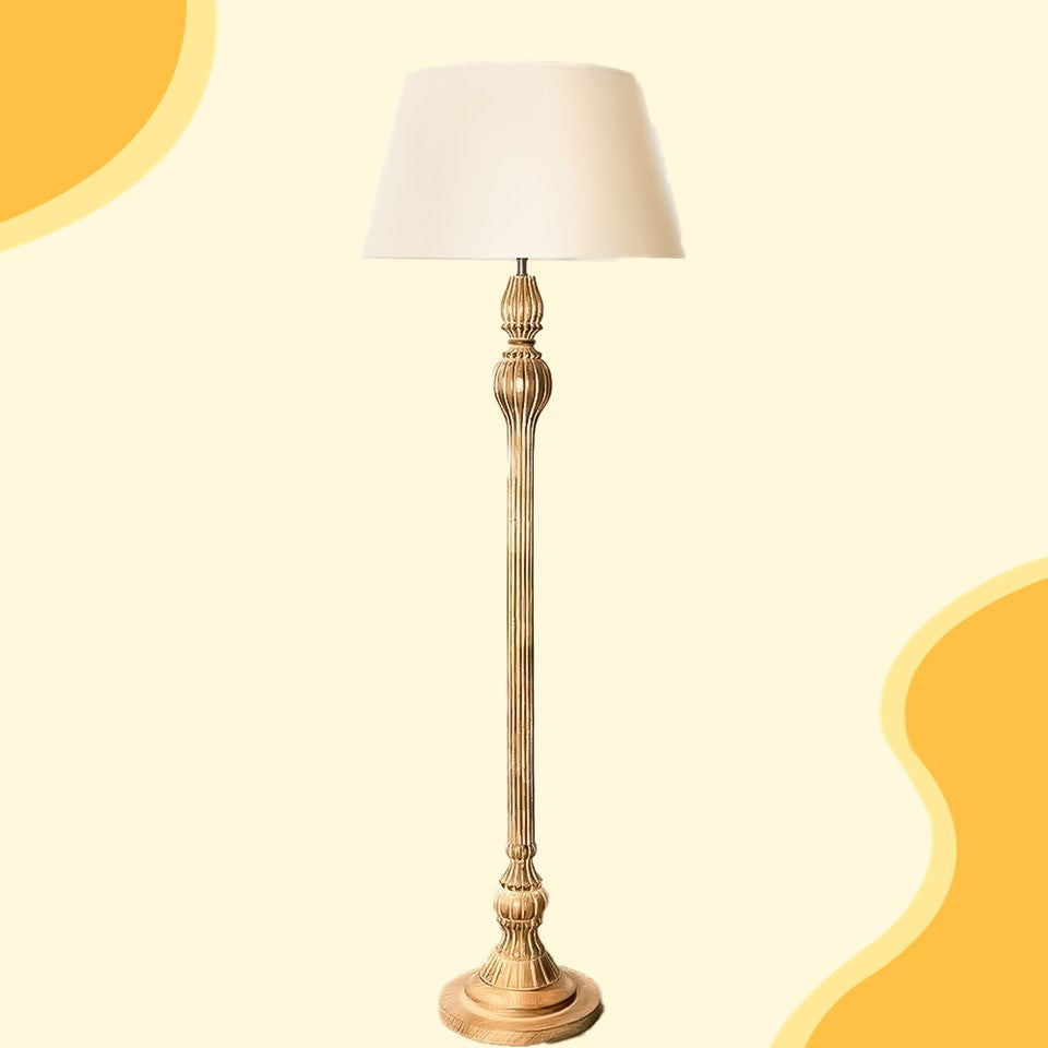 Decorative floor lamp with a white shade on a beige background