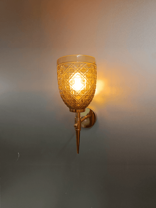 Gold PVD wall light with hand-cut champagne glass for a sparkling sitting room.