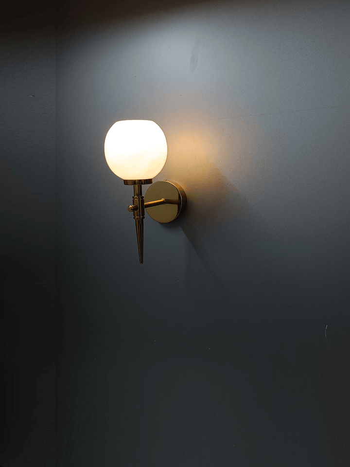 Illuminate your hallway with a gold wall lamp and marble shade (Made in India).