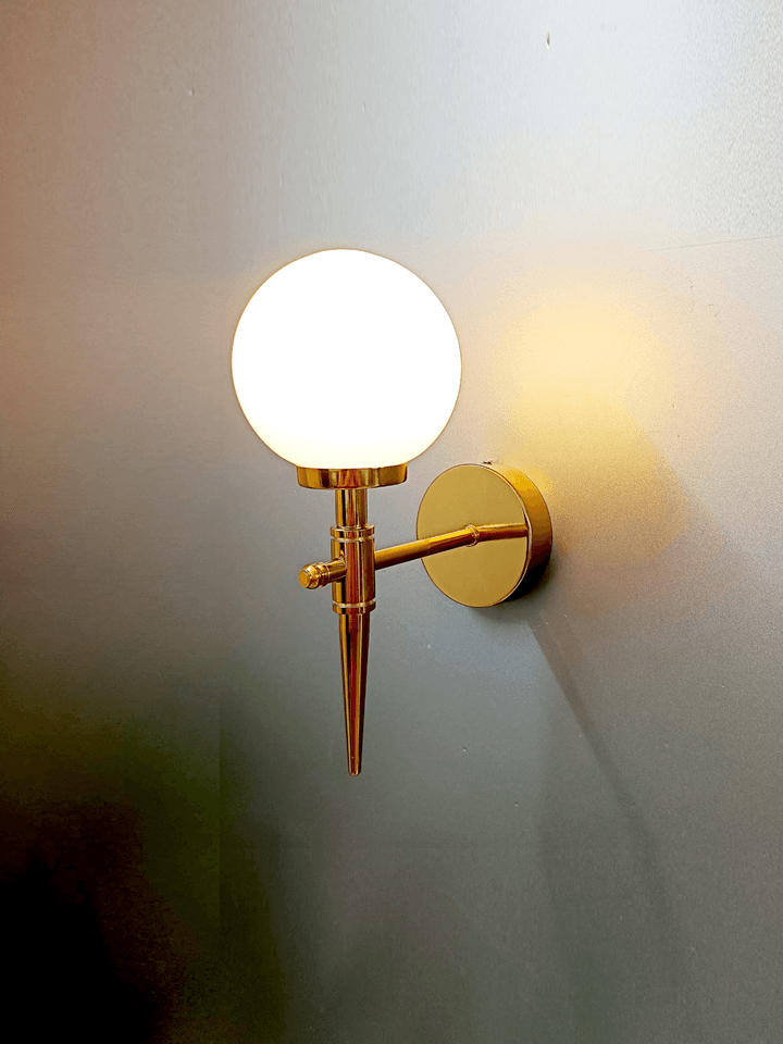 Create a calming ambiance with these gold PVD wall lights featuring frosted opal glass balls.