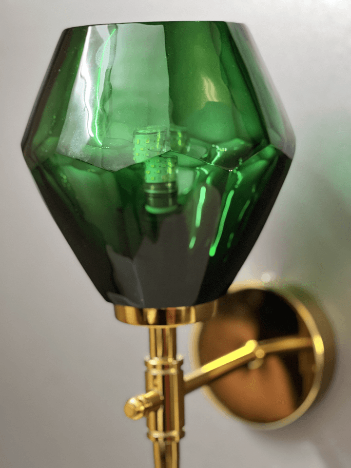 Green crystal wall light showcasing the intricate details of the diamond cut. (Keywords: wall lights for home, green crystal wall light, diamond cut details)