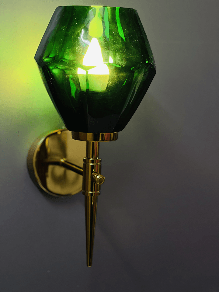 Green crystal wall light displayed in a modern dining room setting. (Keywords: wall lights for home, green crystal wall light, modern dining room)