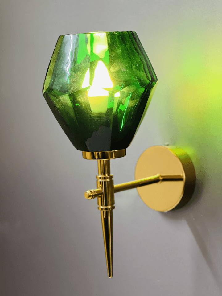 Green crystal wall light installed above a bathroom mirror for a touch of glam. (Keywords: wall lights for home, green crystal wall light, bathroom lighting)