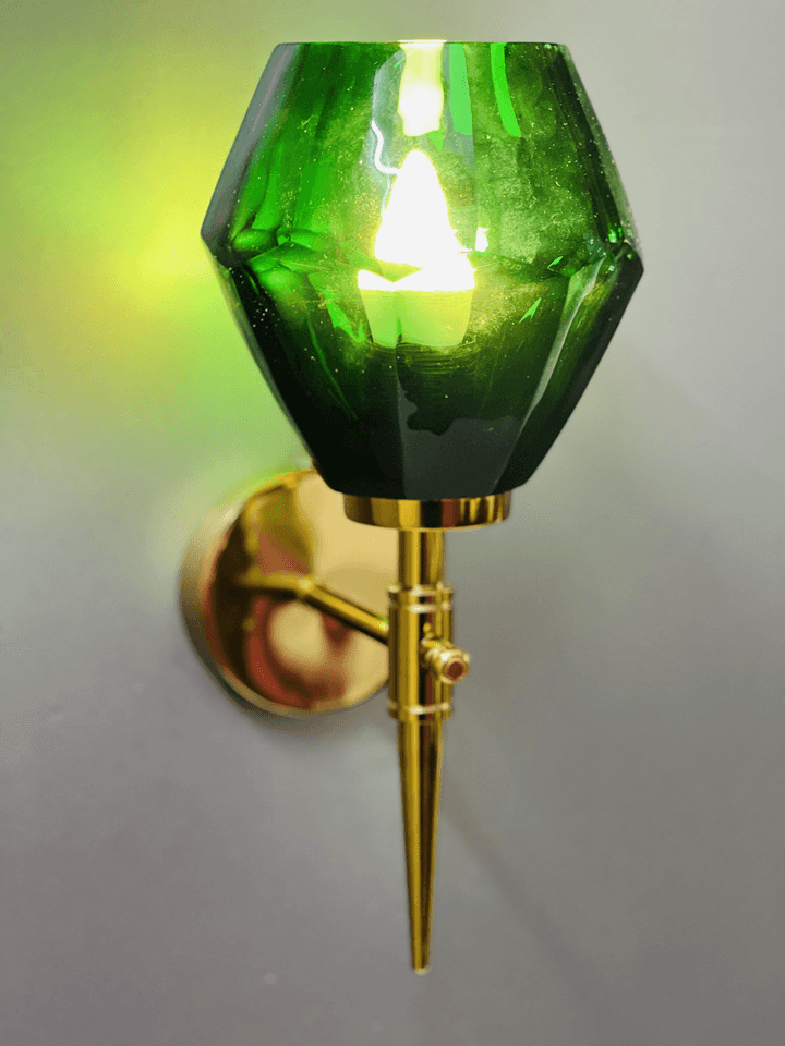 Green crystal wall light displayed next to a potted plant, adding a touch of nature-inspired luxury. (Keywords: wall lights for home, green crystal wall light, nature-inspired)