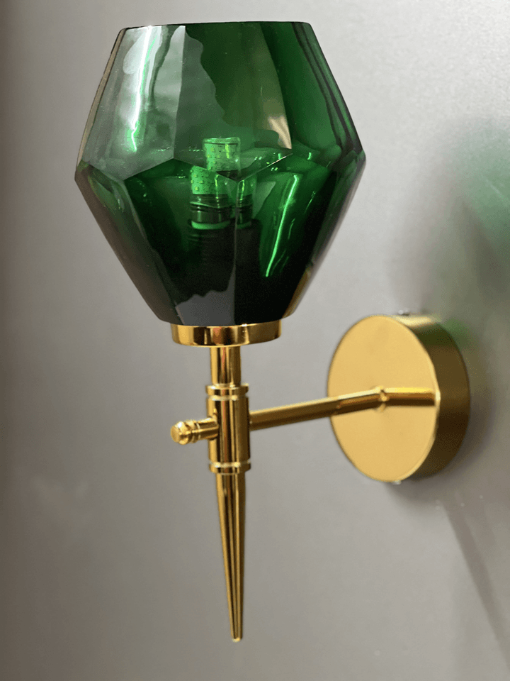 Green crystal wall light casting a patterned light on a ceiling, adding visual interest. (Keywords: wall lights for home, green crystal wall light, light pattern on ceiling