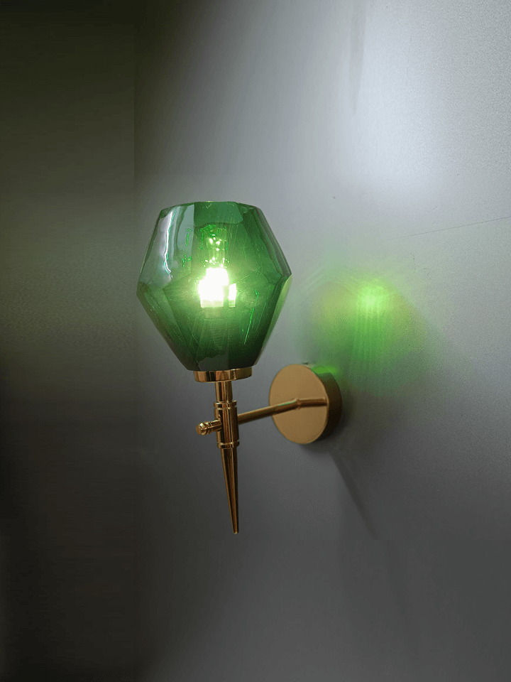 Close-up of hand-cut diamond-cut green crystal glass on a wall light. (Keywords: wall lights for home, hand-cut crystal glass, diamond-cut)