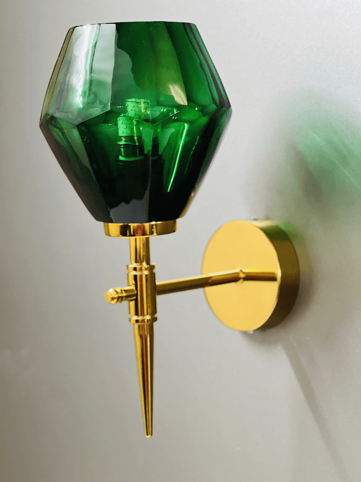 Close-up of the gold PVD base and bulb holder on a green crystal wall light. (Keywords: wall lights for home, green crystal wall light, gold PVD base, E27 bulb holder)