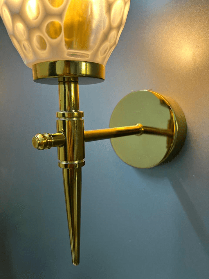 Elegant gold PVD wall light with sparkling crystal glass shade.  pen_spark