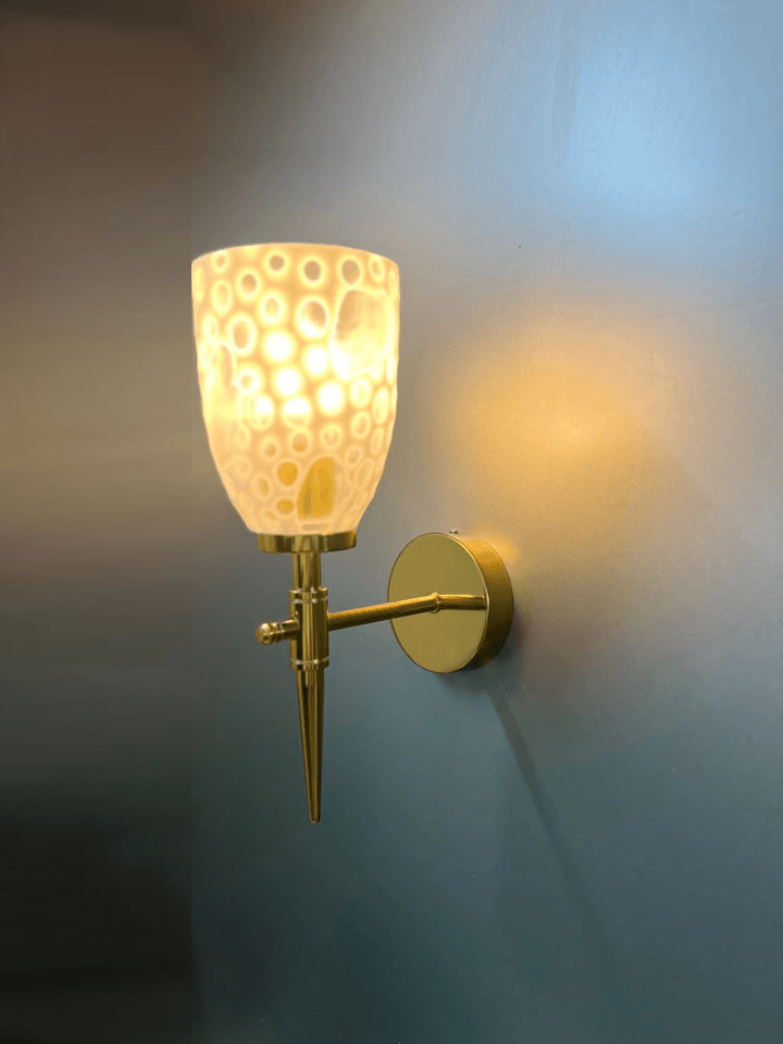 Fancy wall light: gold PVD finish and diamond-cut crystal glass.  pen_spark