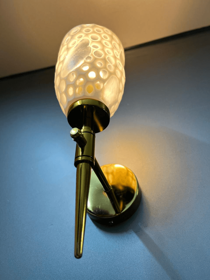 Brighten your space with this gold PVD wall light and crystal glass.