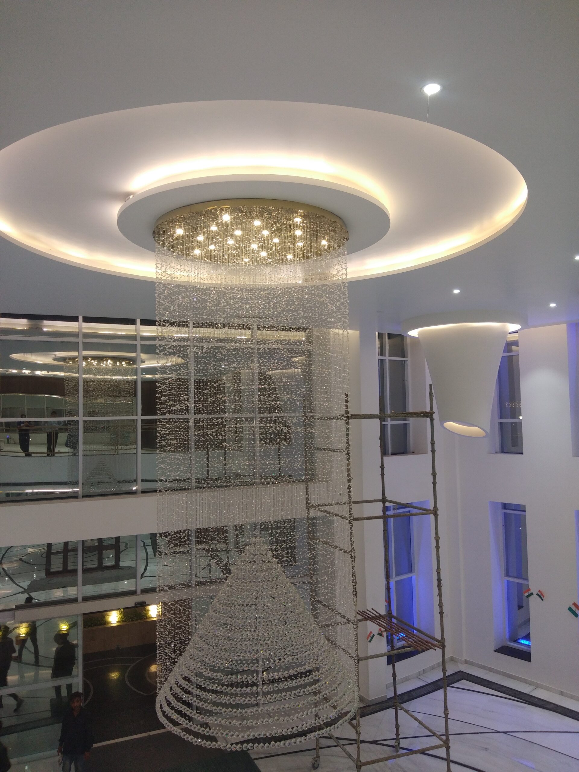 Large crystal chandelier with inner cone form in the Purvanchal Royal City clubhouse