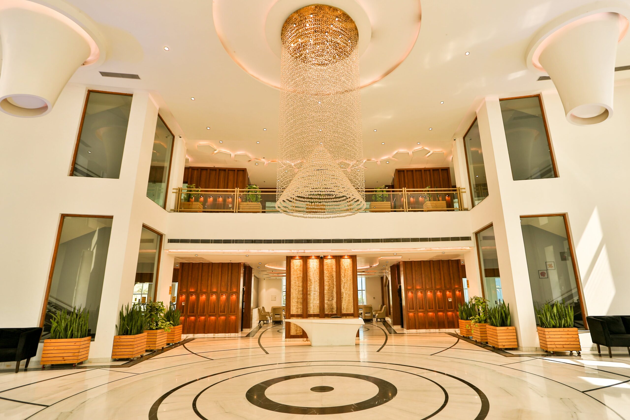 Wide lobby view of the Purvanchal Royal City crystal chandelier installation