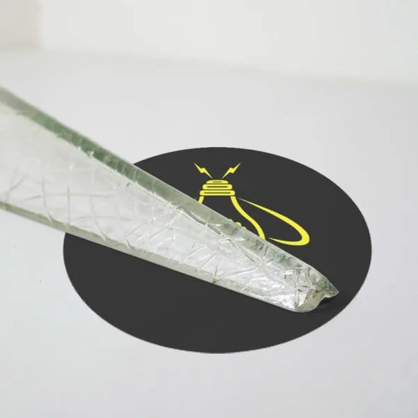 Close-up of the slim rounded end of a crystal edge glass bar, showing the crackle texture in clear borosilicate glass
