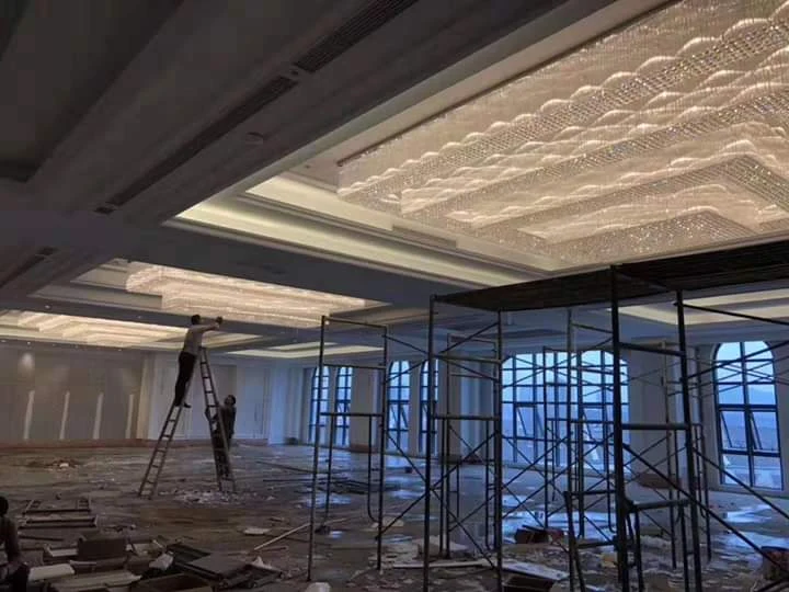 Multiple rectangular waterfall crystal chandeliers installed across the banquet hall at Chateau Royale Nagpur