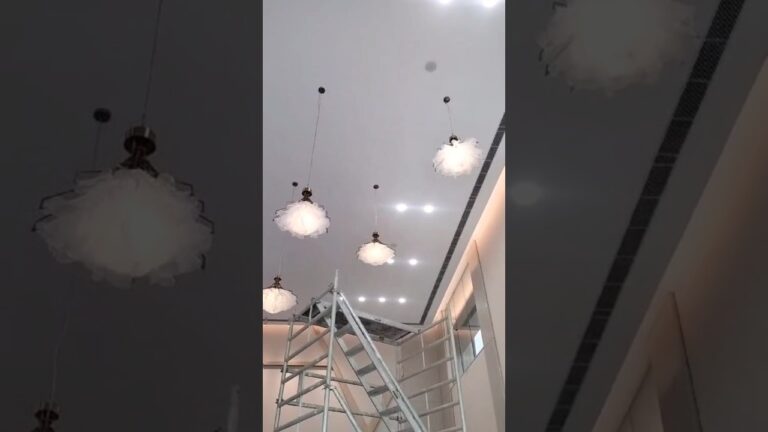 Kinetic chandelier installation showing motion-led chandelier concept