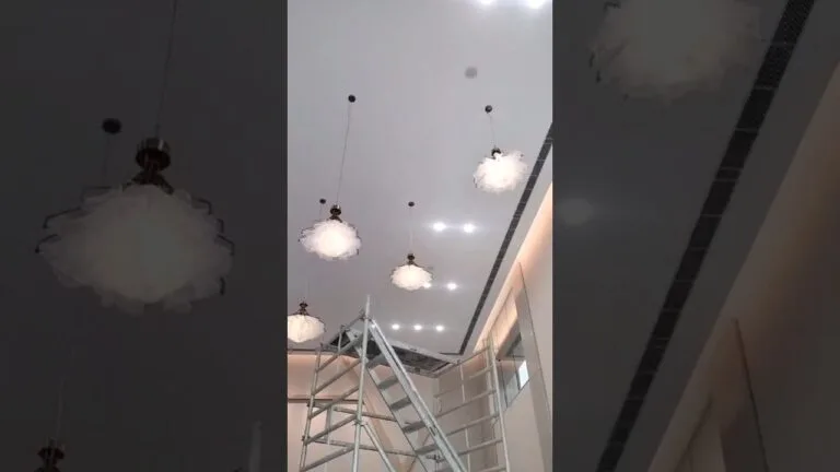 Kinetic chandelier installation showing motion-led chandelier concept