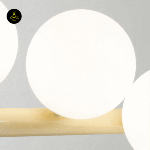 Adjustable-height linear glass ball chandelier on slim ceiling cables