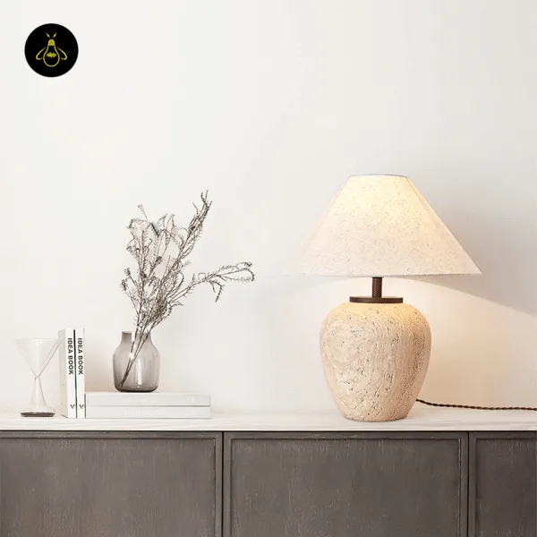 Travertine table lamp illuminating a cozy living room
