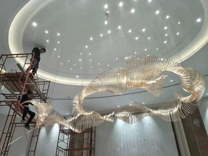 Installation team working beside the 18-foot crystal chandelier at Grand Howrah Banquets Kolkata