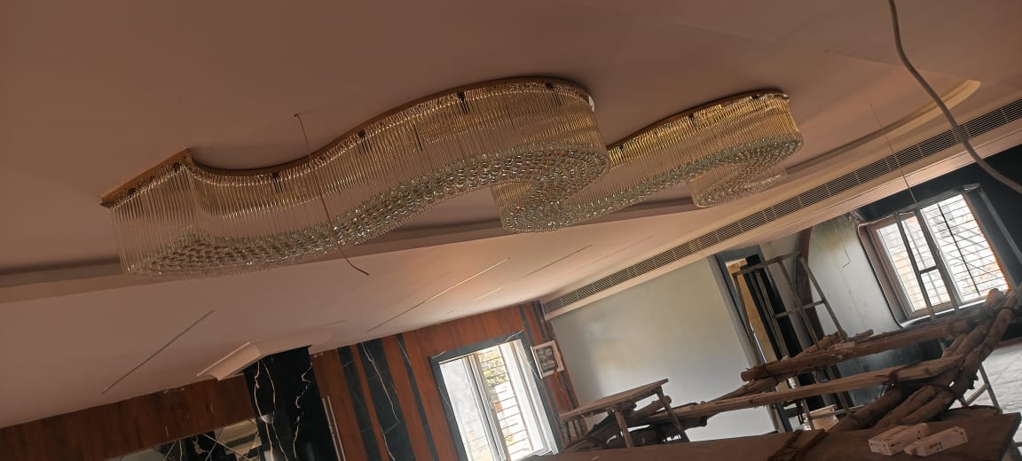 Banquet hall with suspended crystal wave chandelier in Visakhapatnam