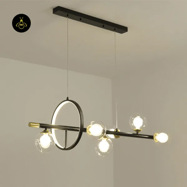 Black and gold dining table chandelier with six glass globe lights and a backlit accent ring