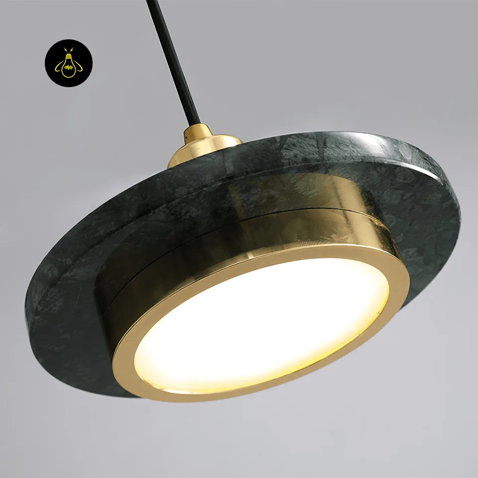 Black Marble Pendant Light – Double Circle Gold LED Drum, 20 cm 3 Close-up of the black marble pendant light showing dark-green clouding in the stone and the lit LED diffuser