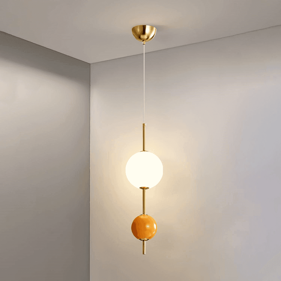 Glass Ball Pendant Light – Gold & Orange Two-Globe Drop, 50 cm | JagMag Lights 3 Glass ball pendant light lit, white opal globe glowing warm above an orange glass ball