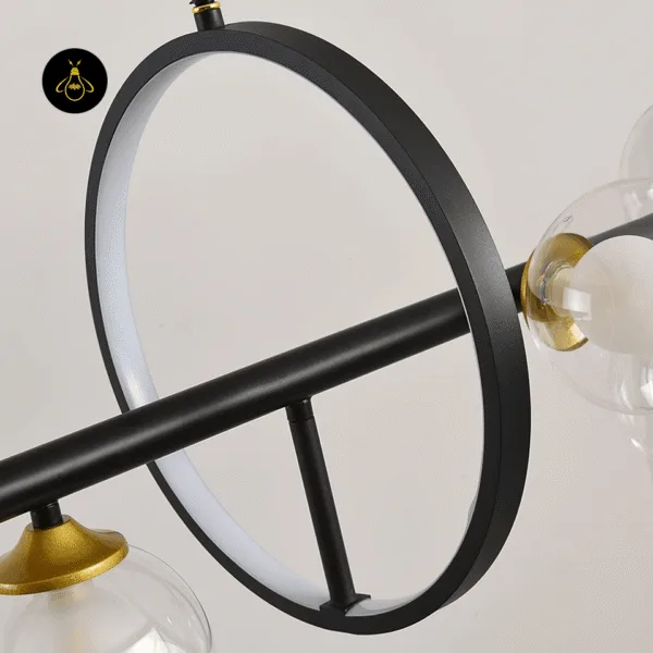 Close-up of the opal LED ring and brushed brass G9 sockets on the linear glass globe chandelier