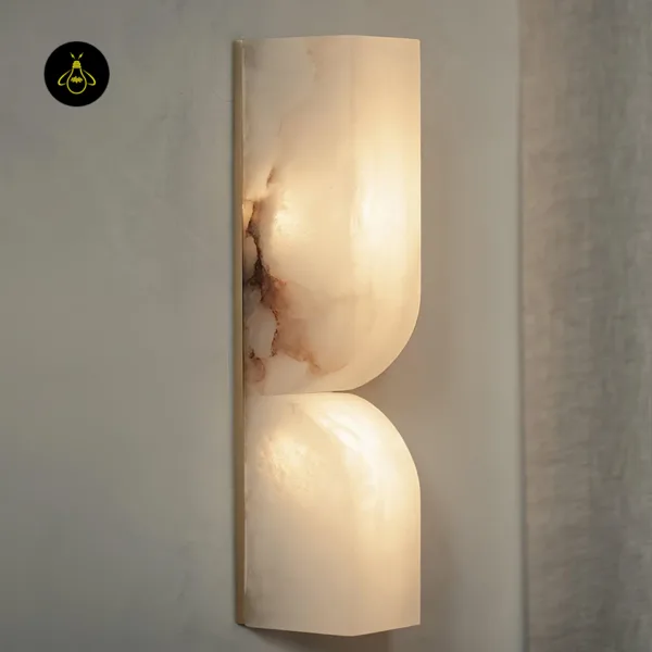 Close-up of the alabaster wall light, lit veins and both scoops glowing