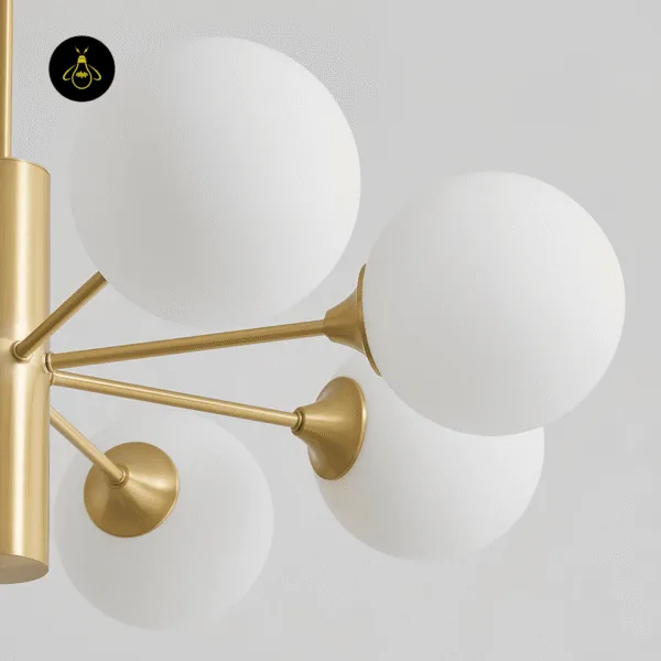 Close-up of the brass finish and flared arms on the modern brass chandelier