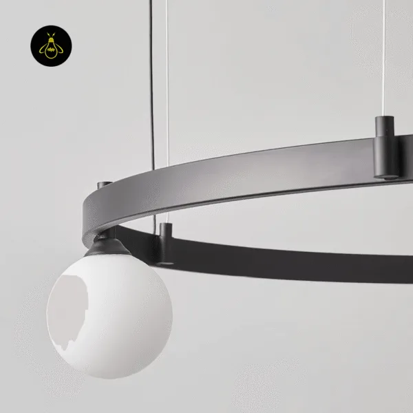 Opal borosilicate glass globe and matte-black ring detail of a modern glass chandelier