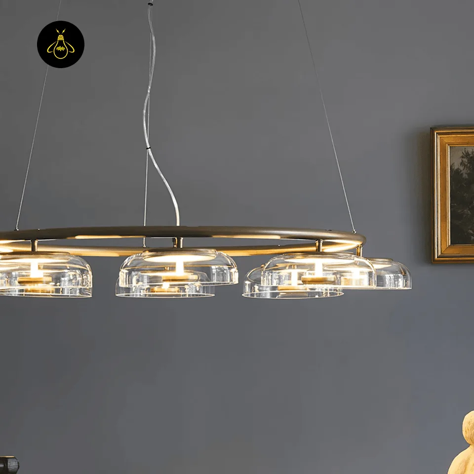 Glass Dome Chandelier – 8-Light Brass LED Ring, 100 cm 3 Close-up of a clear mouth-blown glass dome shade on the brass chandelier