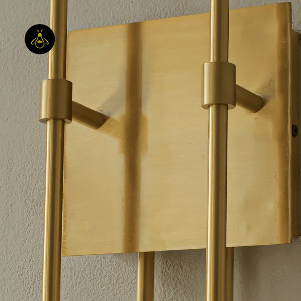 Close-up of the gold wall sconce square backplate in antique gold finish on 304 stainless steel, with stem collars