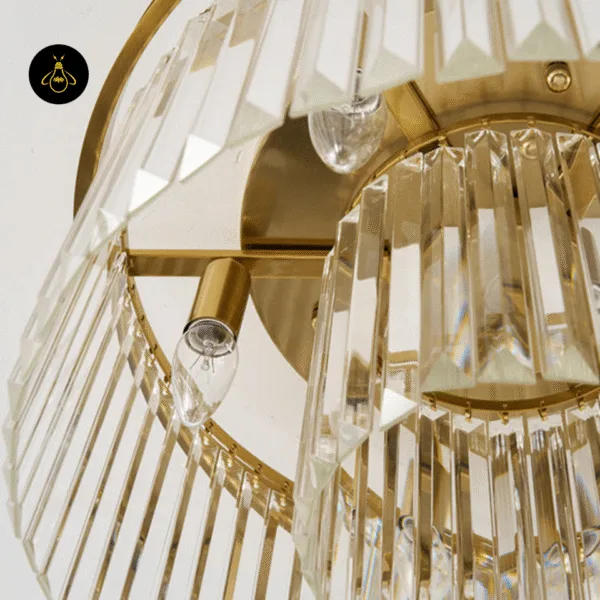 Satin gold finish and clear crystal prism batons of the Eternal Shine crystal chandelier