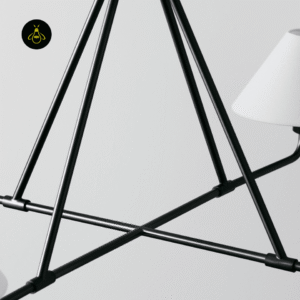 Close-up of a white fabric shade softly diffusing light on the black chandelier