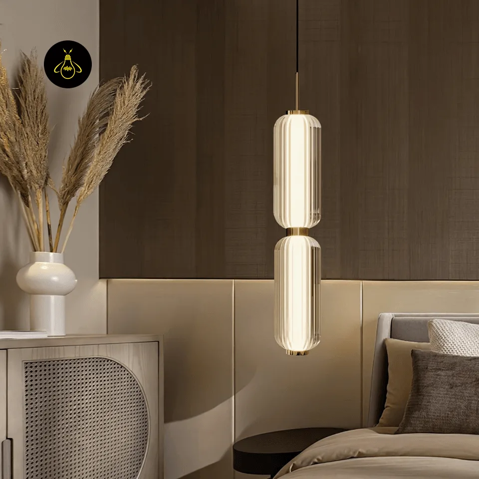 Linear Glass Pendant Light – Ribbed Gold Cylinder, 3 Sizes (31–94 cm) 3 Linear glass pendant light hanging over a kitchen island in a modern Indian home
