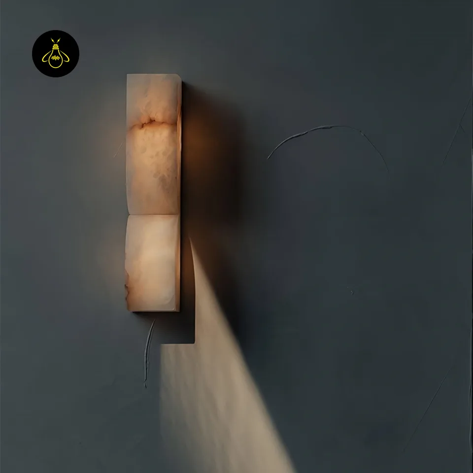 Alabaster Up and Down Wall Light – Carved Natural-Stone Sconce, 35 cm 5 Alabaster up and down wall light casting soft ambient glow on a dark bedroom wall
