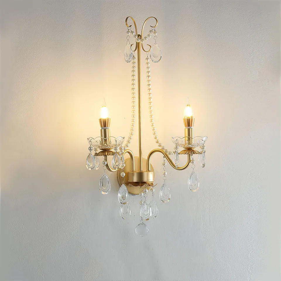 Gold Crystal Wall Sconce – 2-Light Pearl Chain French Sconce, 64 cm 5 Crystal wall sconce in gold finish lighting a hallway with soft warm glow