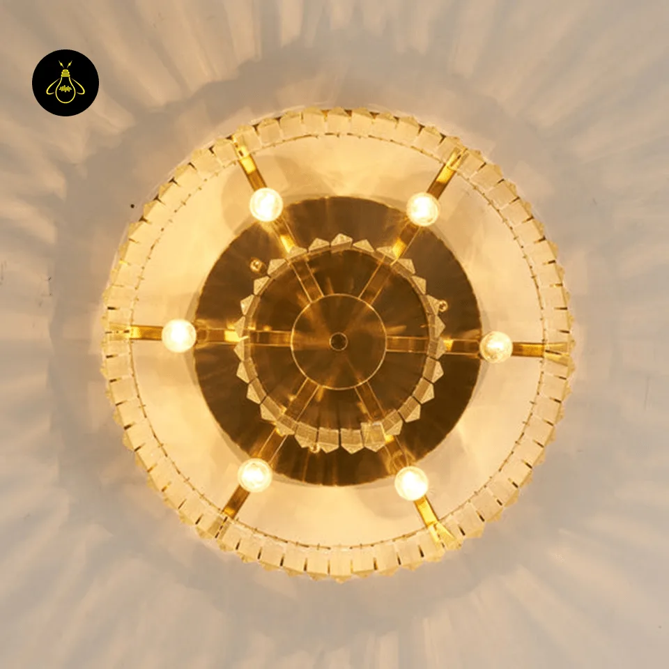 Rectangular Crystal Chandelier – Satin Gold 2-Tier Eternal Shine 7 Underside of a round crystal chandelier showing warm G9 bulbs on satin gold arms