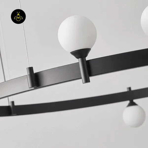 Matte-black stainless steel ring and glass globe sockets of a modern glass chandelier