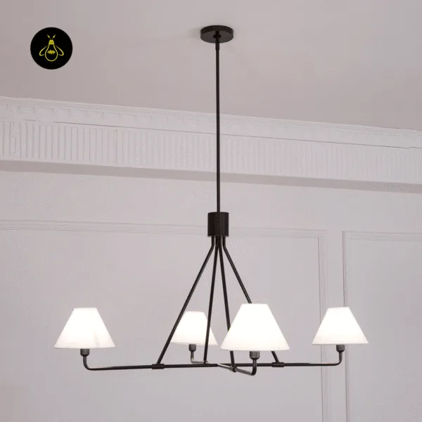 Detail of the minimalist black stainless steel frame on the white fabric chandelier