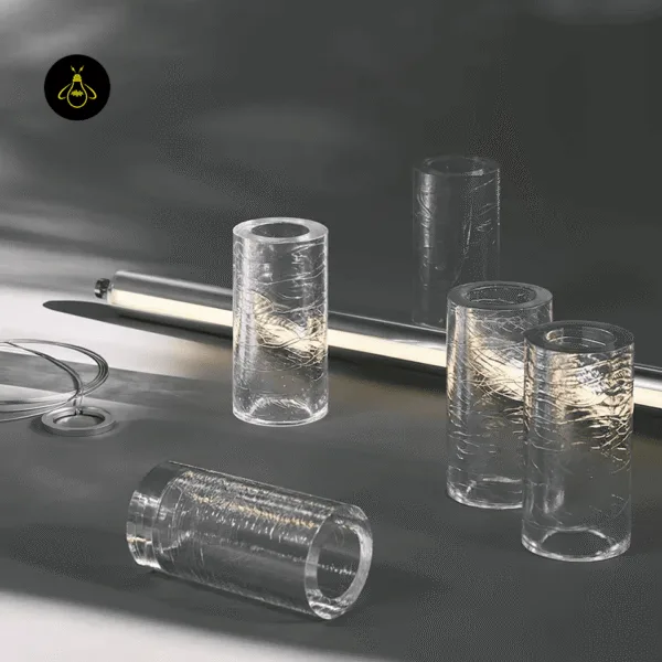 Chrome stainless steel end caps and clear borosilicate glass segments of the linear glass chandelier