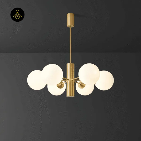 Eight illuminated opal borosilicate glass globes glowing on the modern brass chandelier