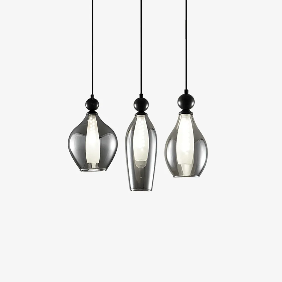 Black smoked glass pendant light cluster over a dining table