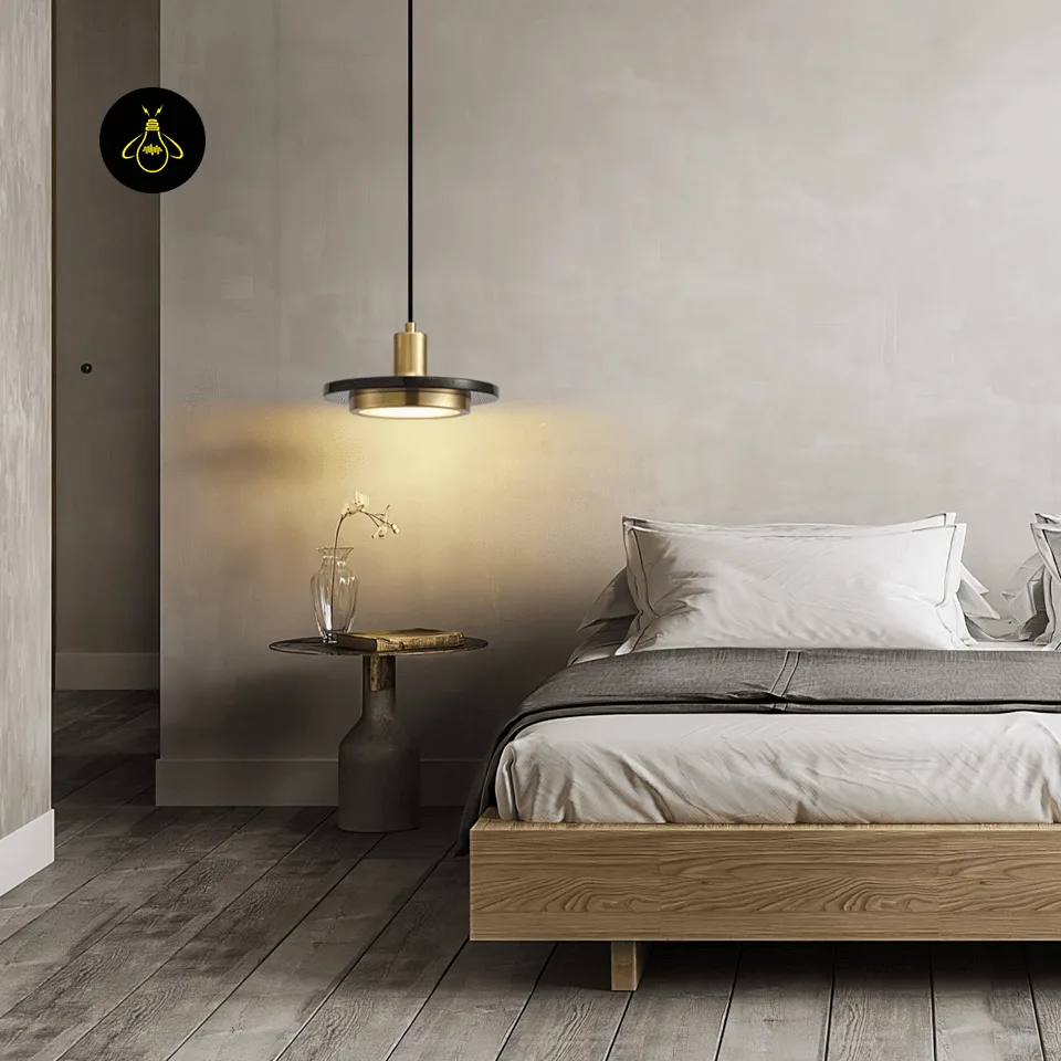 Black Marble Pendant Light – Double Circle Gold LED Drum, 20 cm 5 Black marble pendant light beside a bed, casting warm light on the nightstand and wall